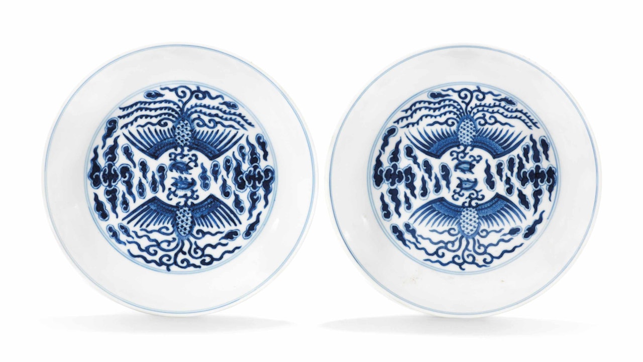 A PAIR OF SMALL BLUE AND WHITE 'DOUBLE PHOENIX' SAUCER DISHES by Anonymous