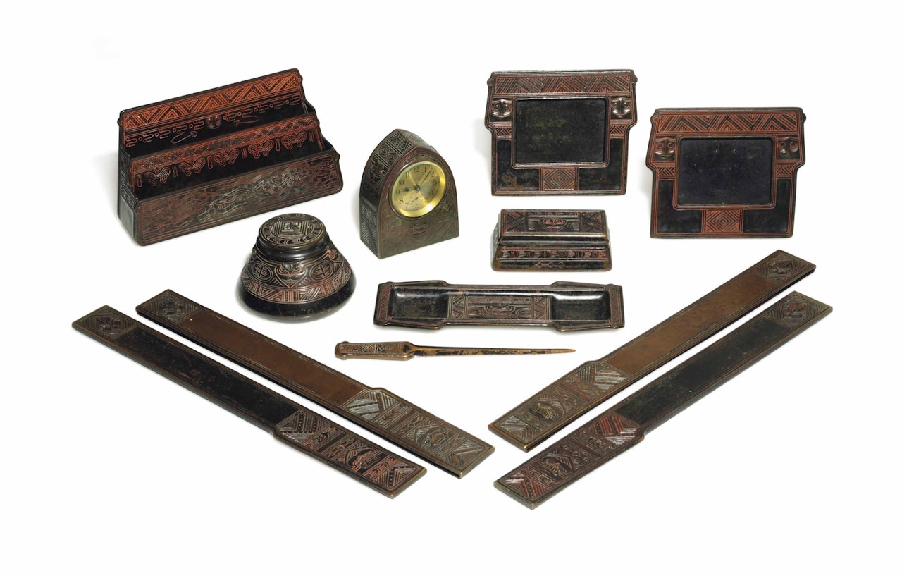 AN ASSEMBLED TWELVE-PIECE 'AMERICAN INDIAN' DESK SET by Tiffany Studios