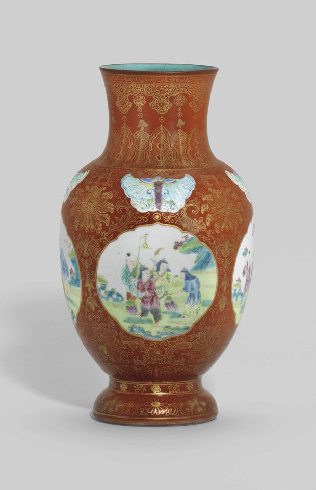 A CORAL-GROUND FAMILLE ROSE 'BOYS' VASE by Anonymous