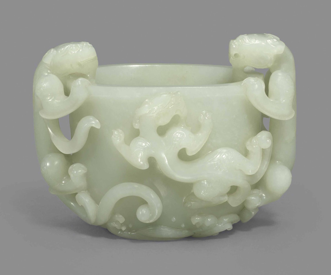 A WHITE JADE ‘CHILONG’ WASHER by Anonymous