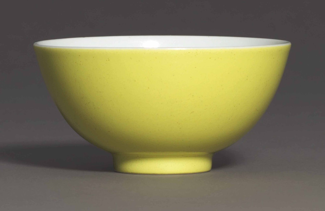 A LEMON-YELLOW ENAMELLED WINE CUP by Anonymous