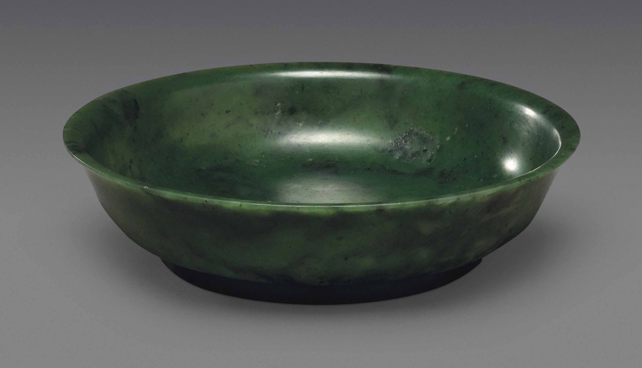 A SPINACH-GREEN JADE DISH by Anonymous