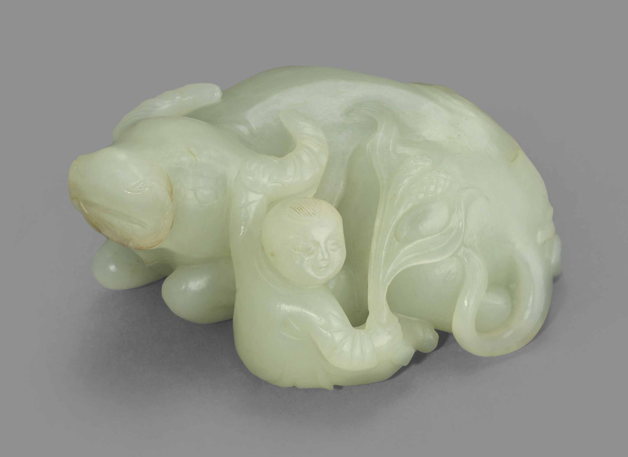 A PALE CELADON JADE 'BOY AND BUFFALO' GROUP by Anonymous