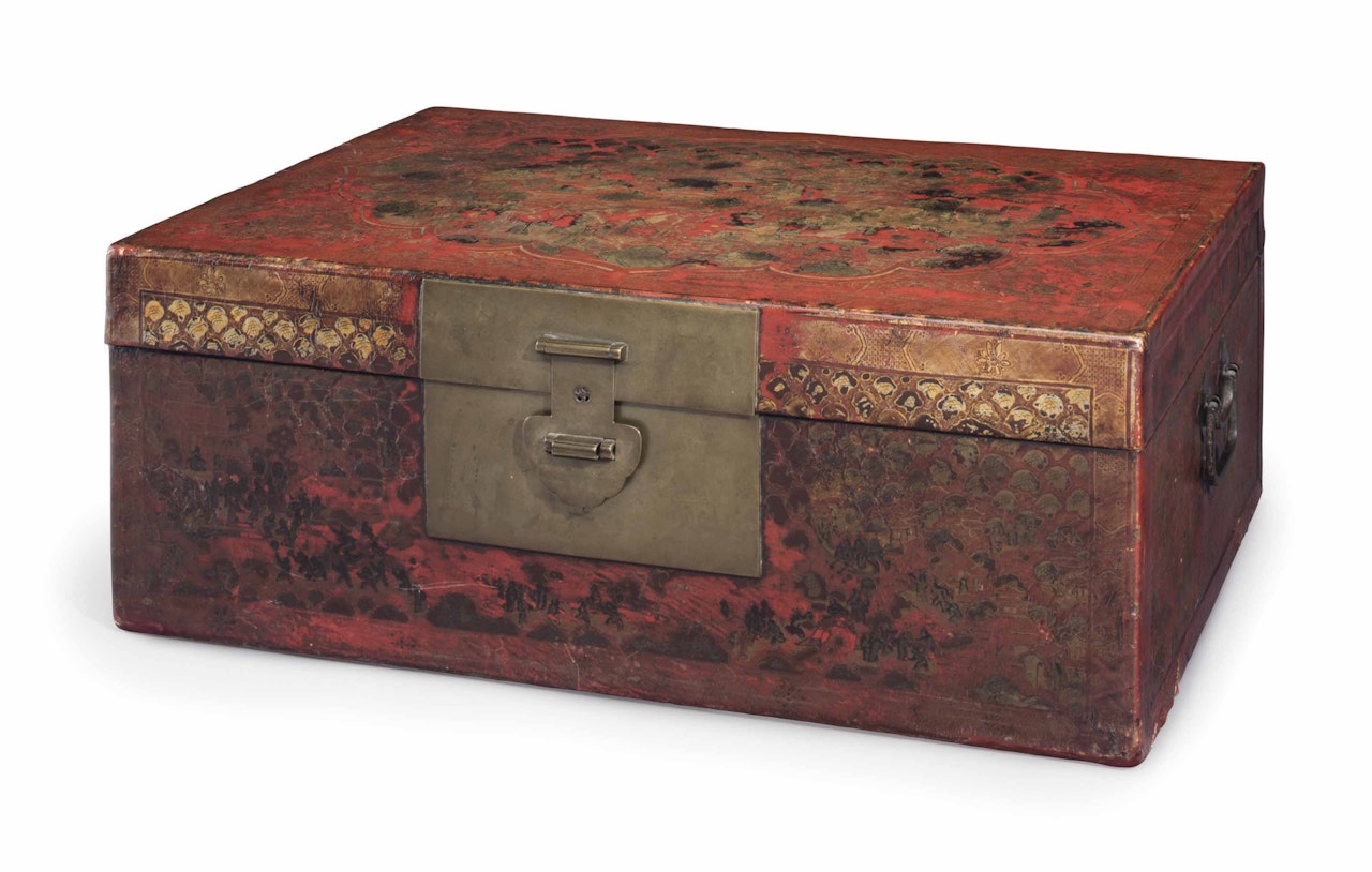 A GILT-DECORATED RED LACQUERED LEATHER-WRAPPED WOOD CHEST by Anonymous