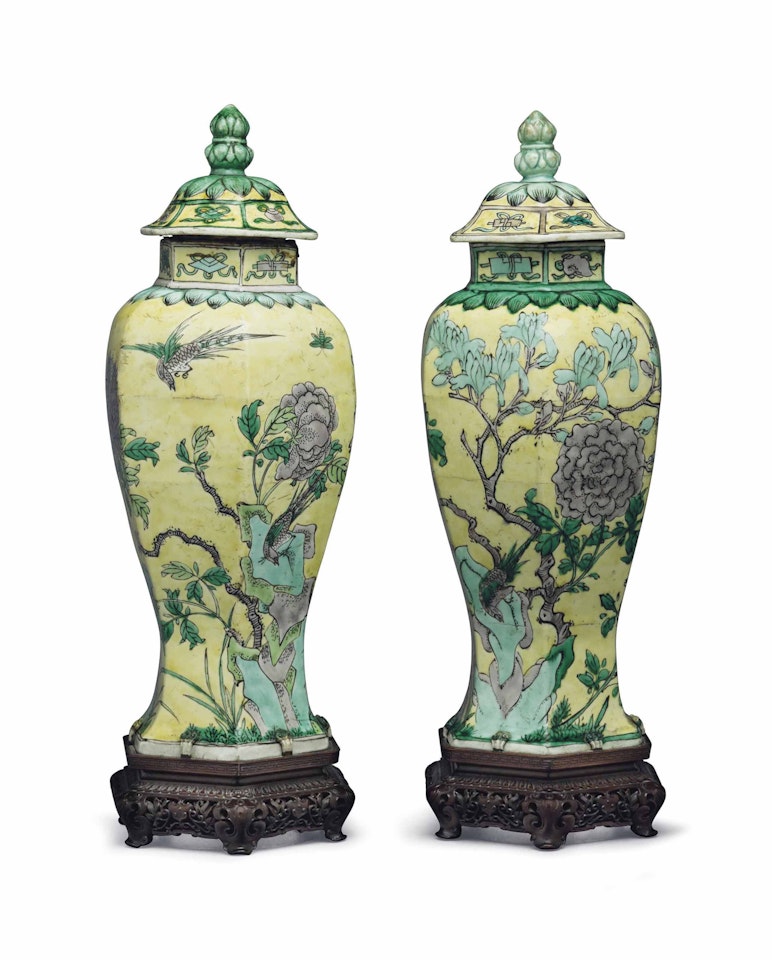 A PAIR OF YELLOW-GROUND FAMILLE VERTE HEXAGONAL VASES AND COVERS by Anonymous