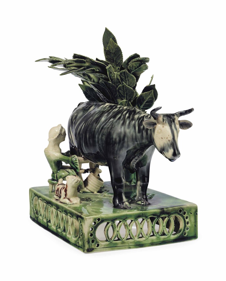 A STAFFORDSHIRE CREAMWARE MILKING GROUP by Anonymous