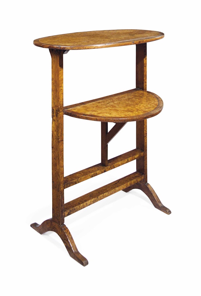 A NORTH EUROPEAN KARELIAN BIRCH AND TULIPWOOD TWO-TIER WORK TABLE by Anonymous