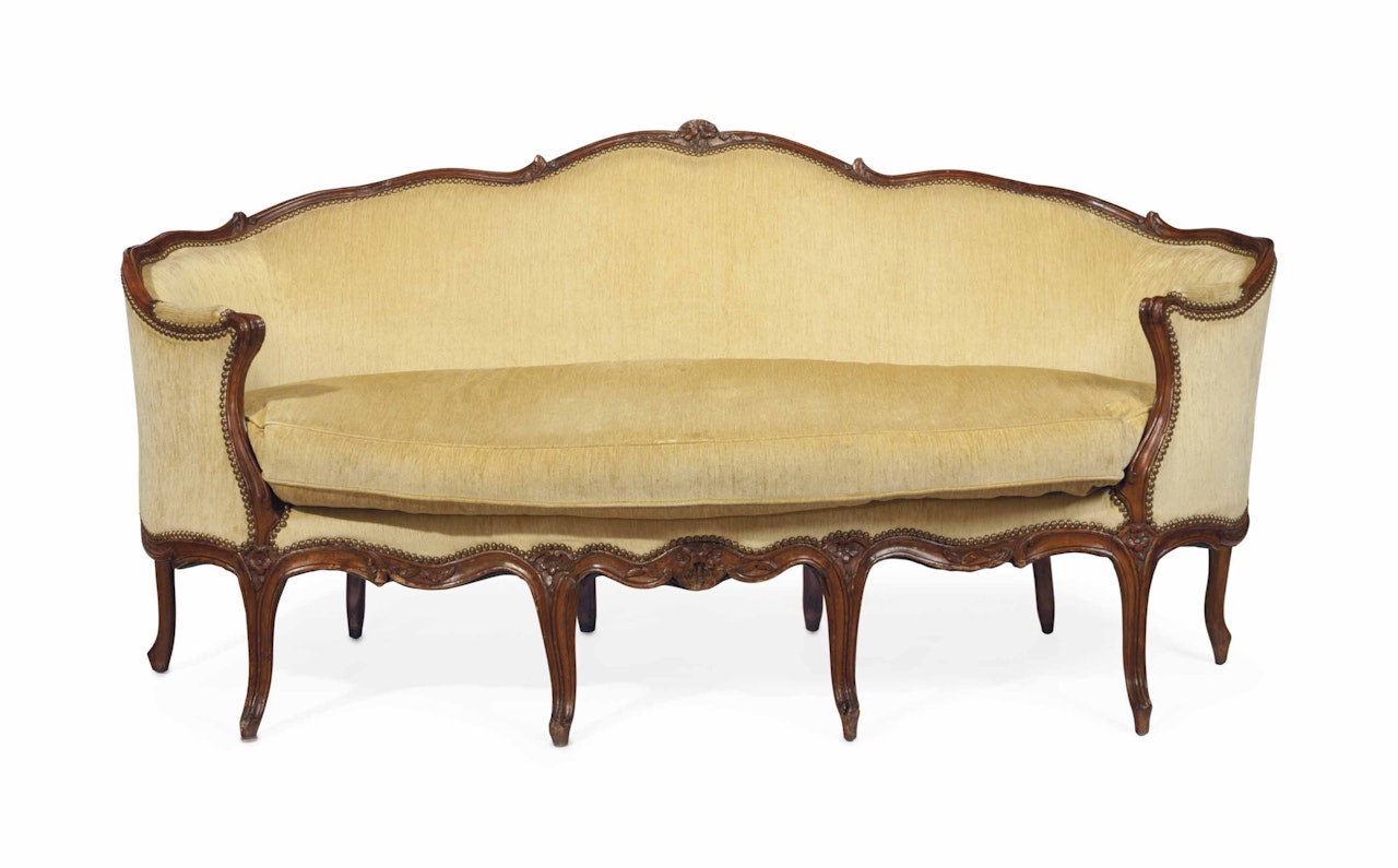 A LOUIS XV WALNUT AND BEECHWOOD CANAPE by Anonymous