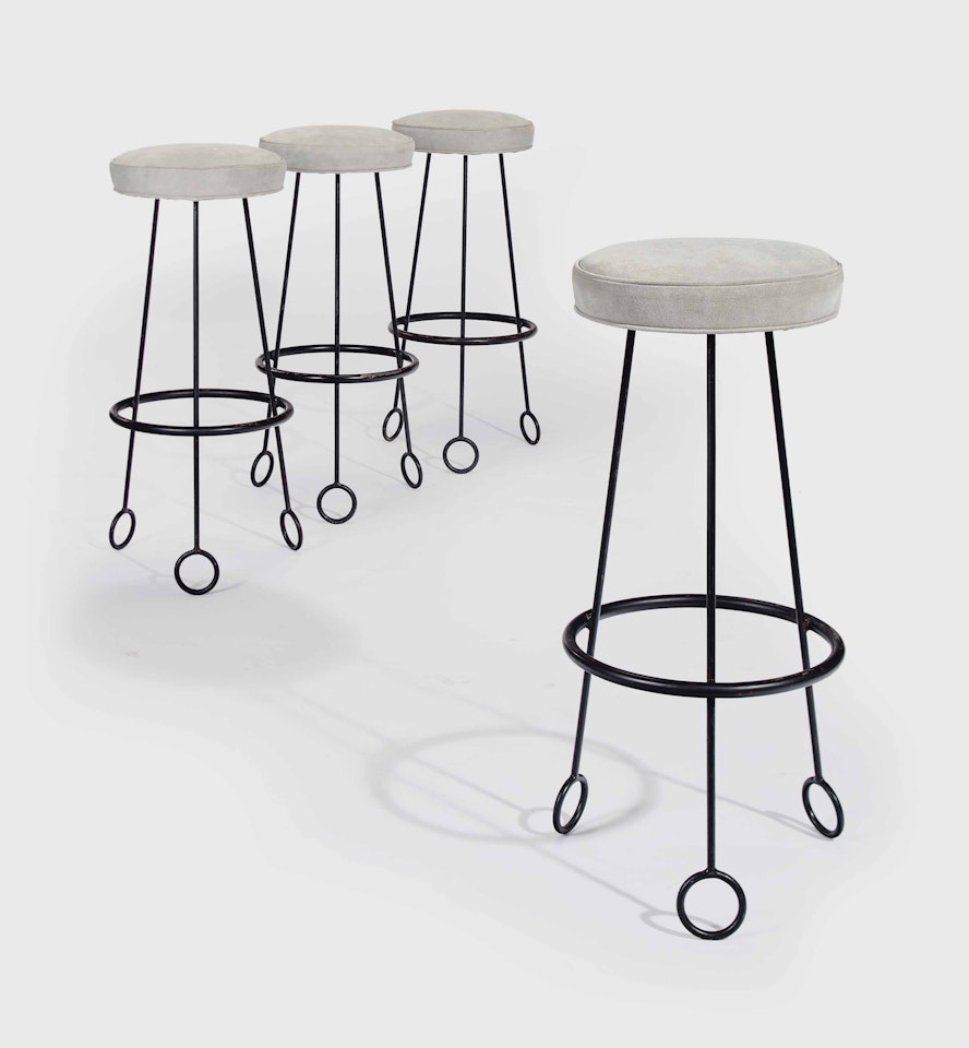 A SET OF FOUR 'YO-YO' BAR STOOLS by Jean Royere
