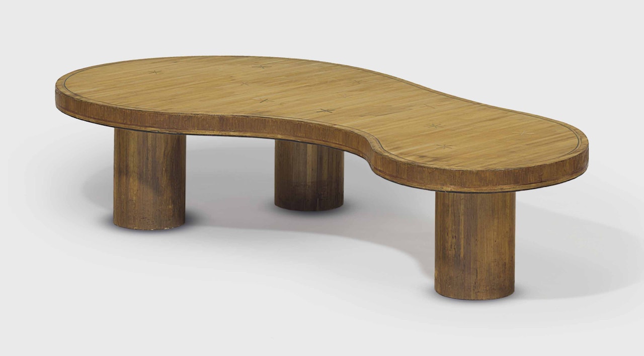 A 'FLAQUE' LOW TABLE by Jean Royere