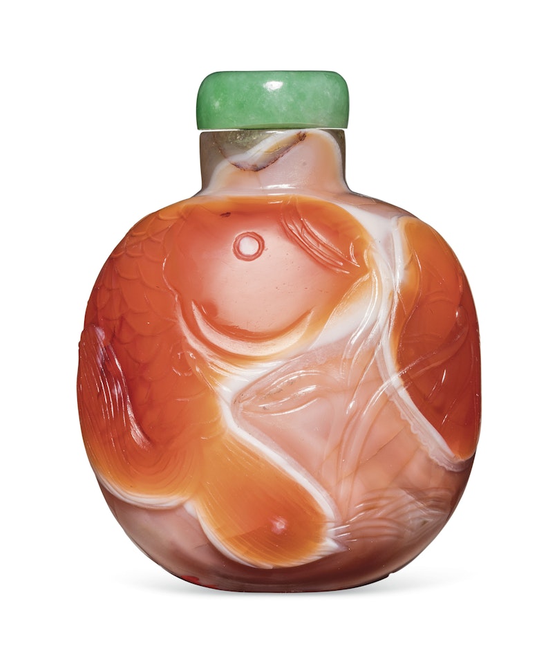 A CARVED CARNELIAN AGATE SNUFF BOTTLE by Anonymous