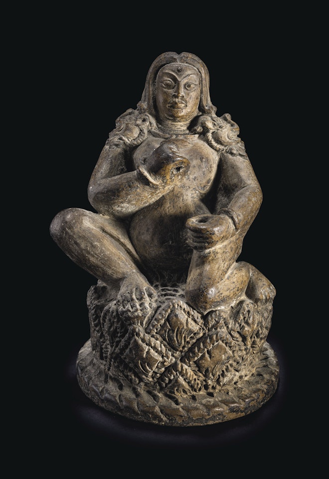 A TERRACOTTA FIGURE OF A MAHASIDDHA by Anonymous