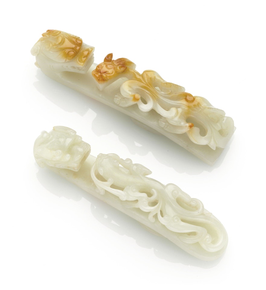 TWO LARGE WHITE JADE BELT BUCKLES by Anonymous