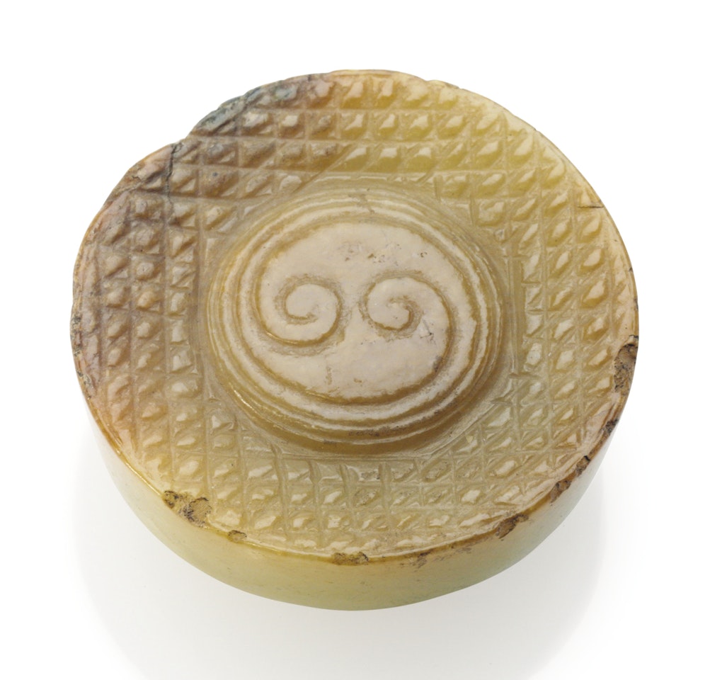 A YELLOW AND PALE RUSSET JADE POMMEL by Anonymous