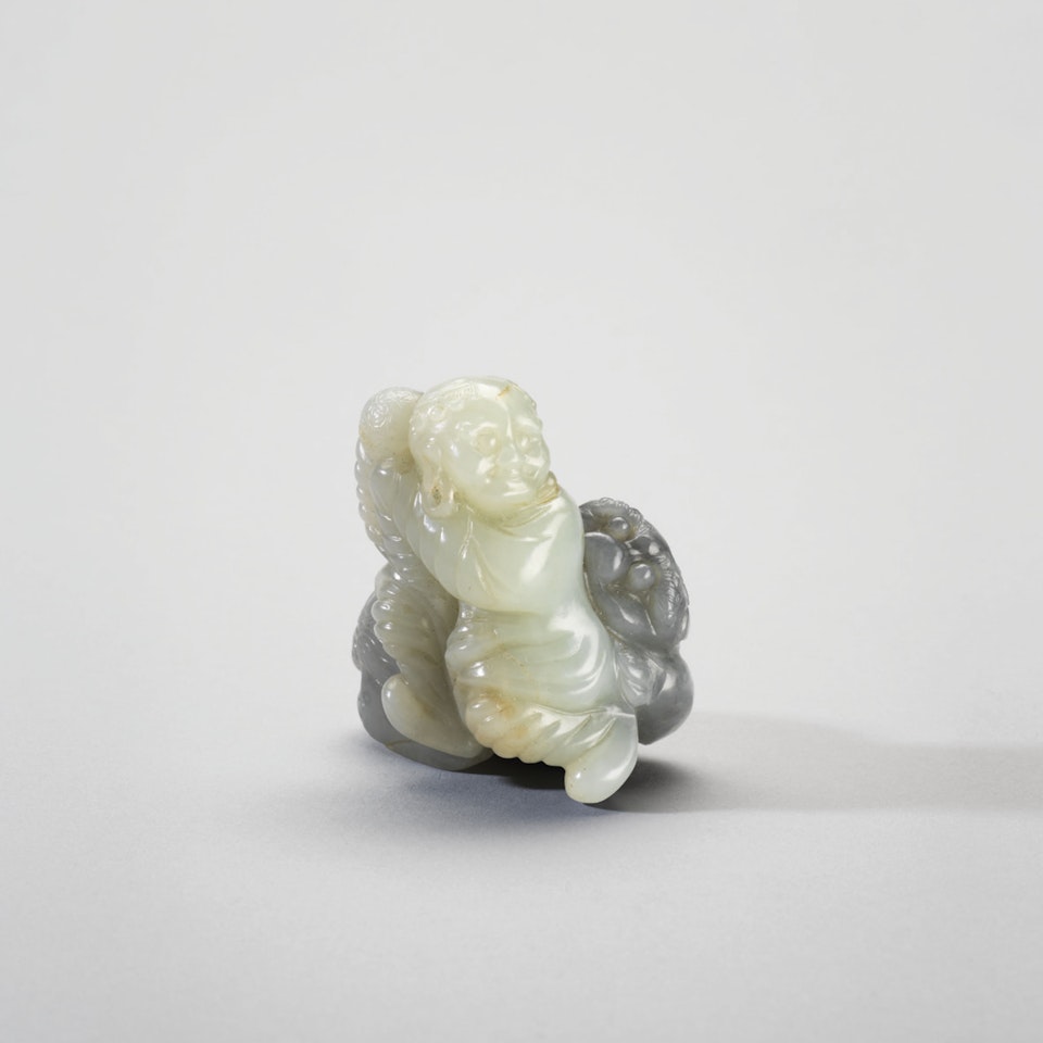 A GREY AND WHITE JADE FIGURAL GROUP by Anonymous