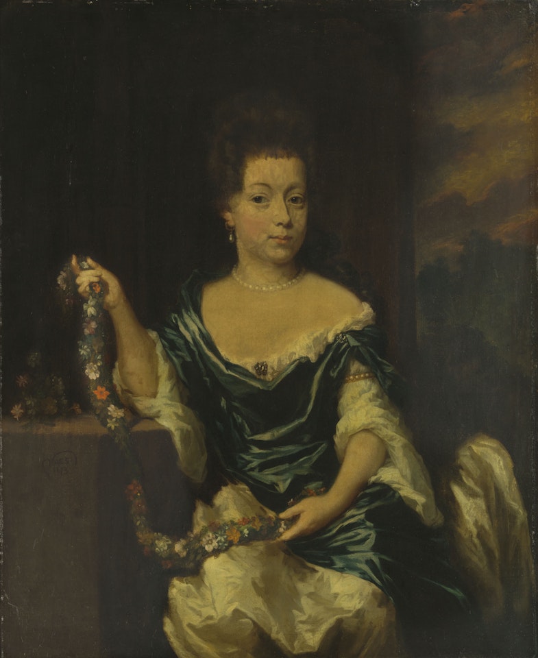 Portrait of a woman seated at a table holding a garland of flowers, three-quarter-length, a view into a landscape beyond by Nicolaes Maes