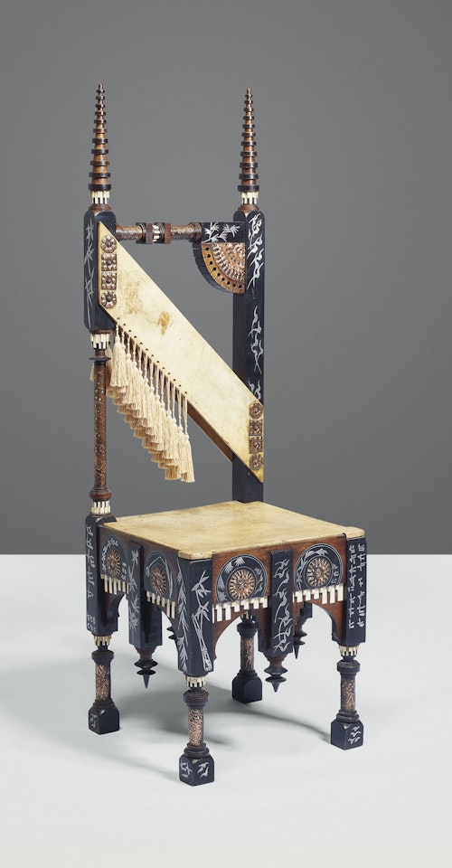 A CHAIR by Carlo Bugatti