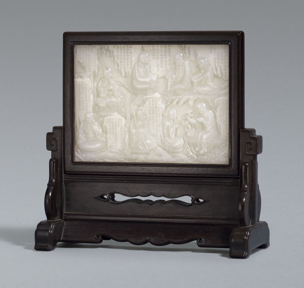 A WHITE JADE 'LUOHAN' TABLE SCREEN AND ZITAN STAND by Anonymous