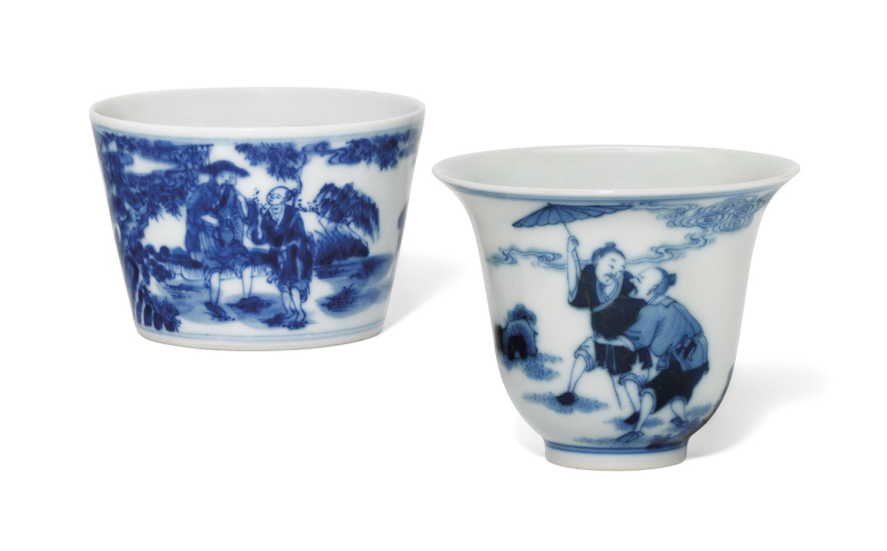 TWO BLUE AND WHITE 'FIGURAL' CUPS by Anonymous