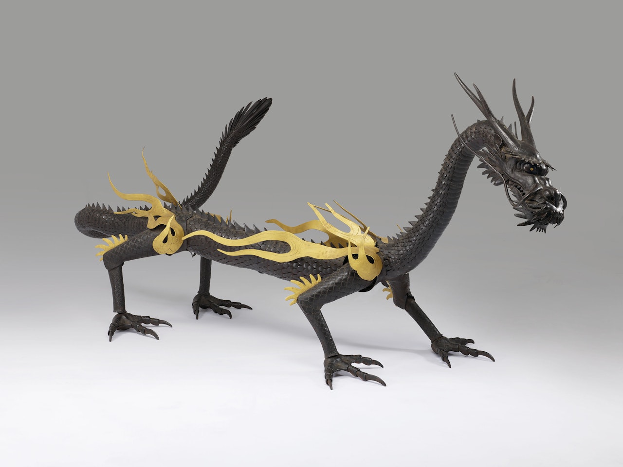 An important iron articulated sculpture of a dragon by Anonymous