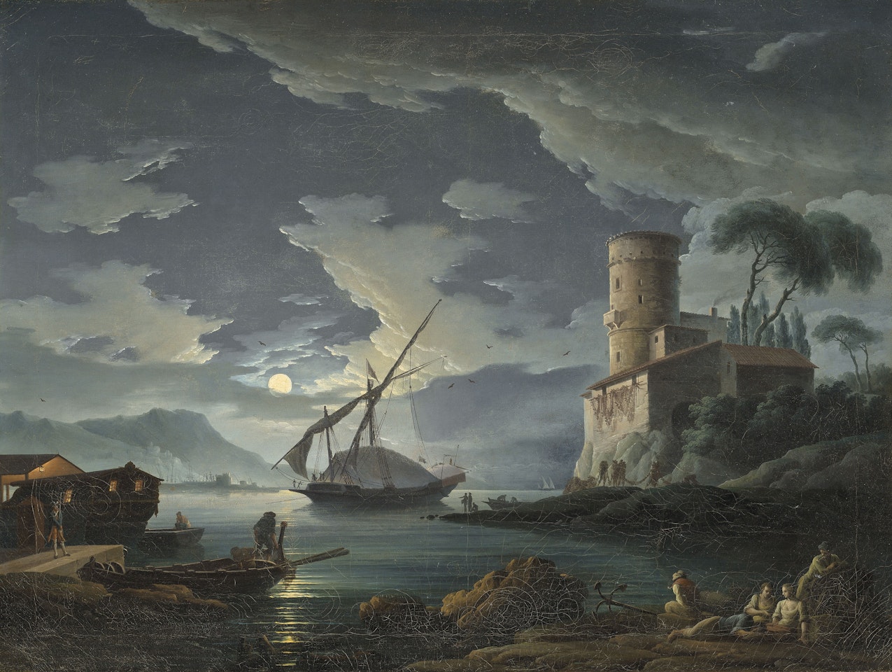 A moonlit landscape of a Mediterranean harbour by Carlo Bonavia