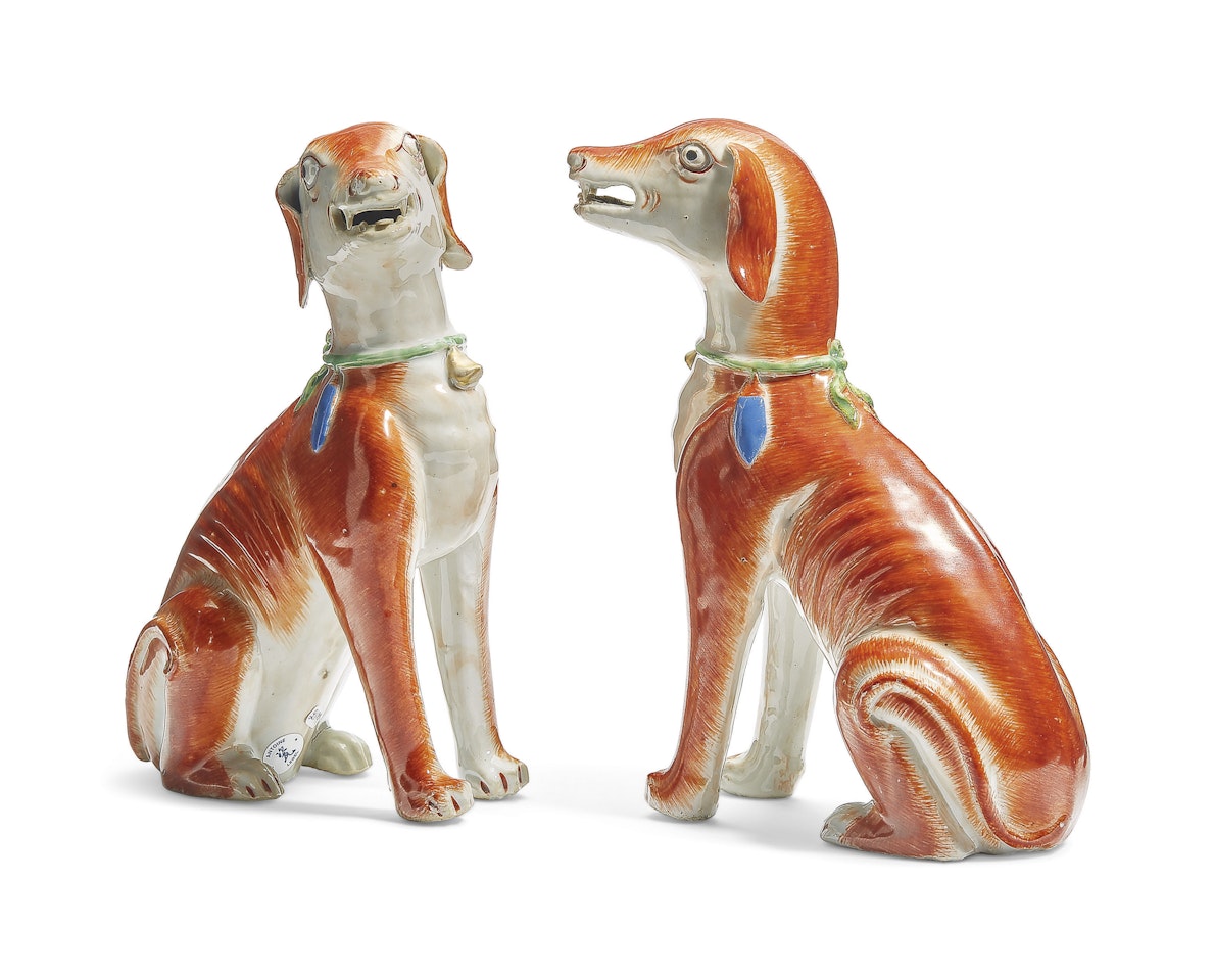 A LARGE PAIR OF SEATED HOUNDS by Anonymous