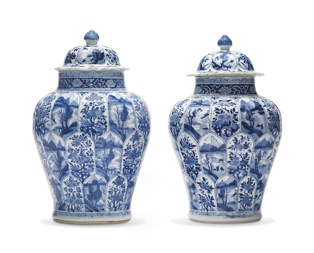 A LARGE PAIR OF BLUE AND WHITE JARS AND COVERS by Anonymous