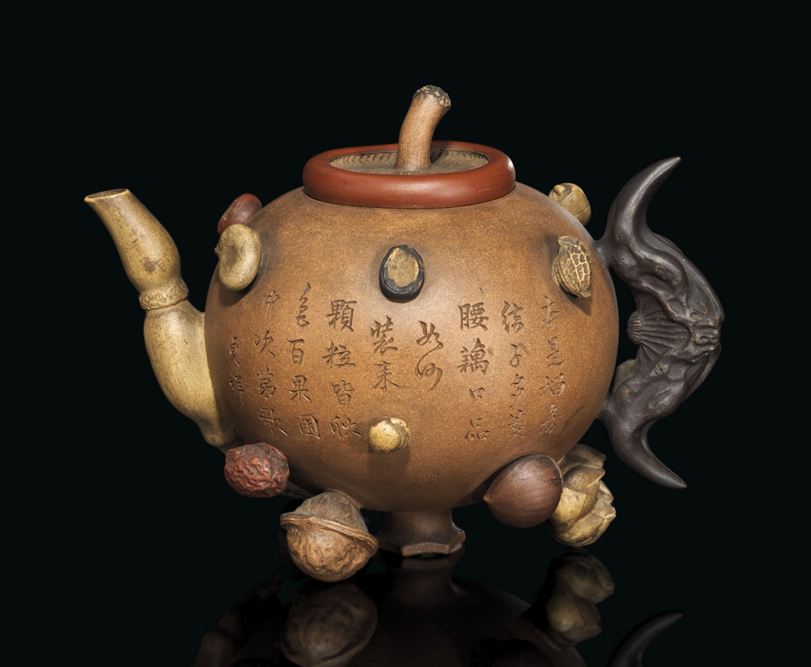 AN YIXING 'HUNDRED-FRUIT' TEAPOT AND COVER by Anonymous