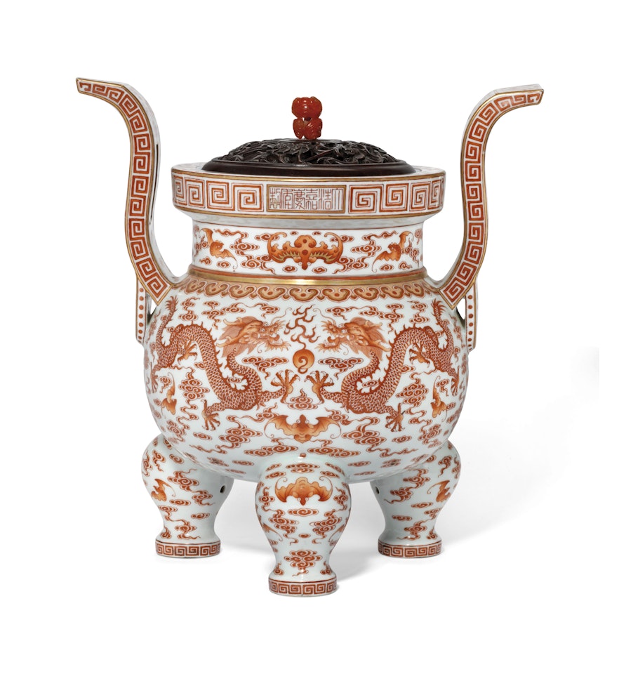 A FINE IRON-RED, FAMILLE ROSE AND GILT-DECORATED TRIPOD CENSER by Anonymous