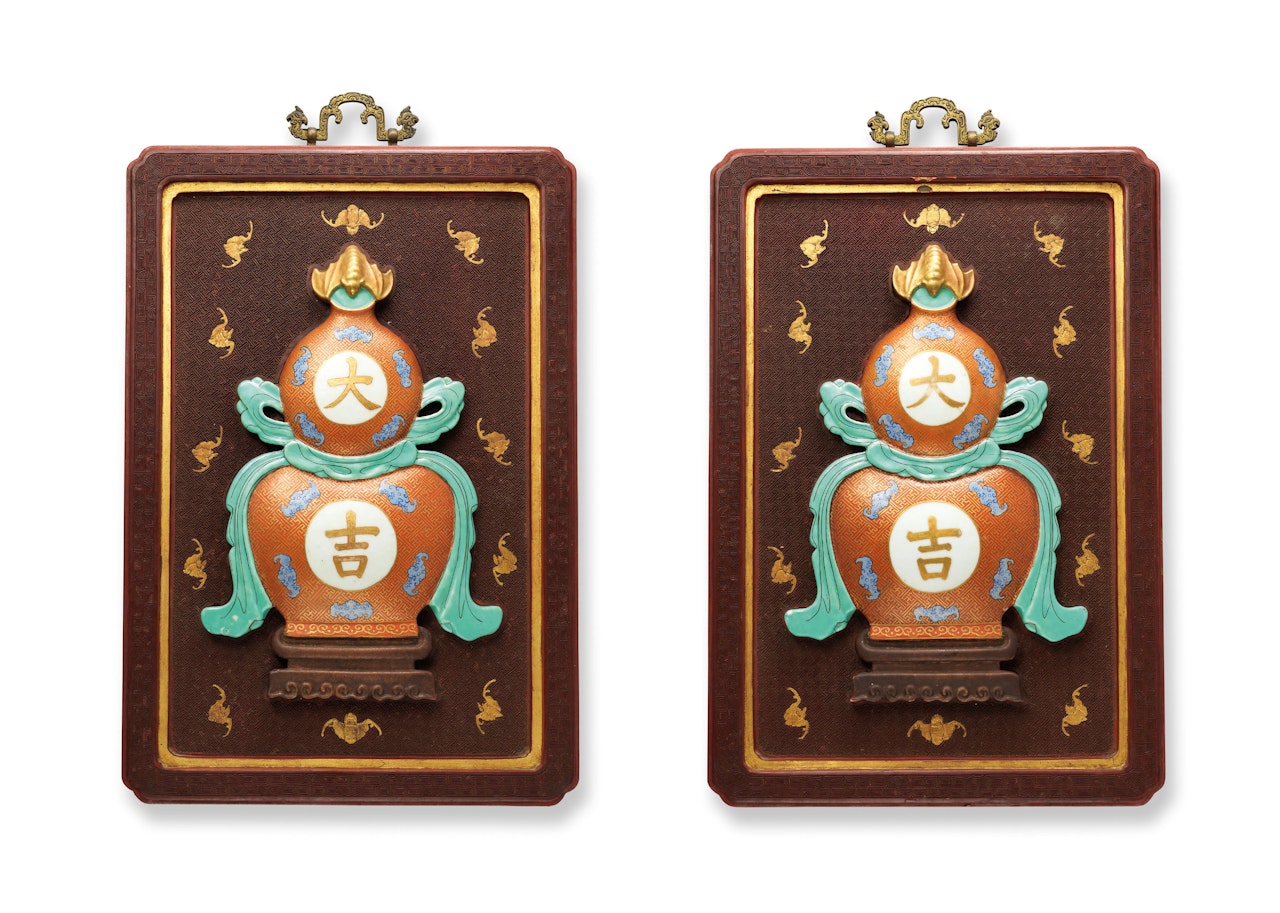 A PAIR OF FAMILLE ROSE ‘DAJI’ DOUBLE-GOURD WALL PLAQUES by Anonymous