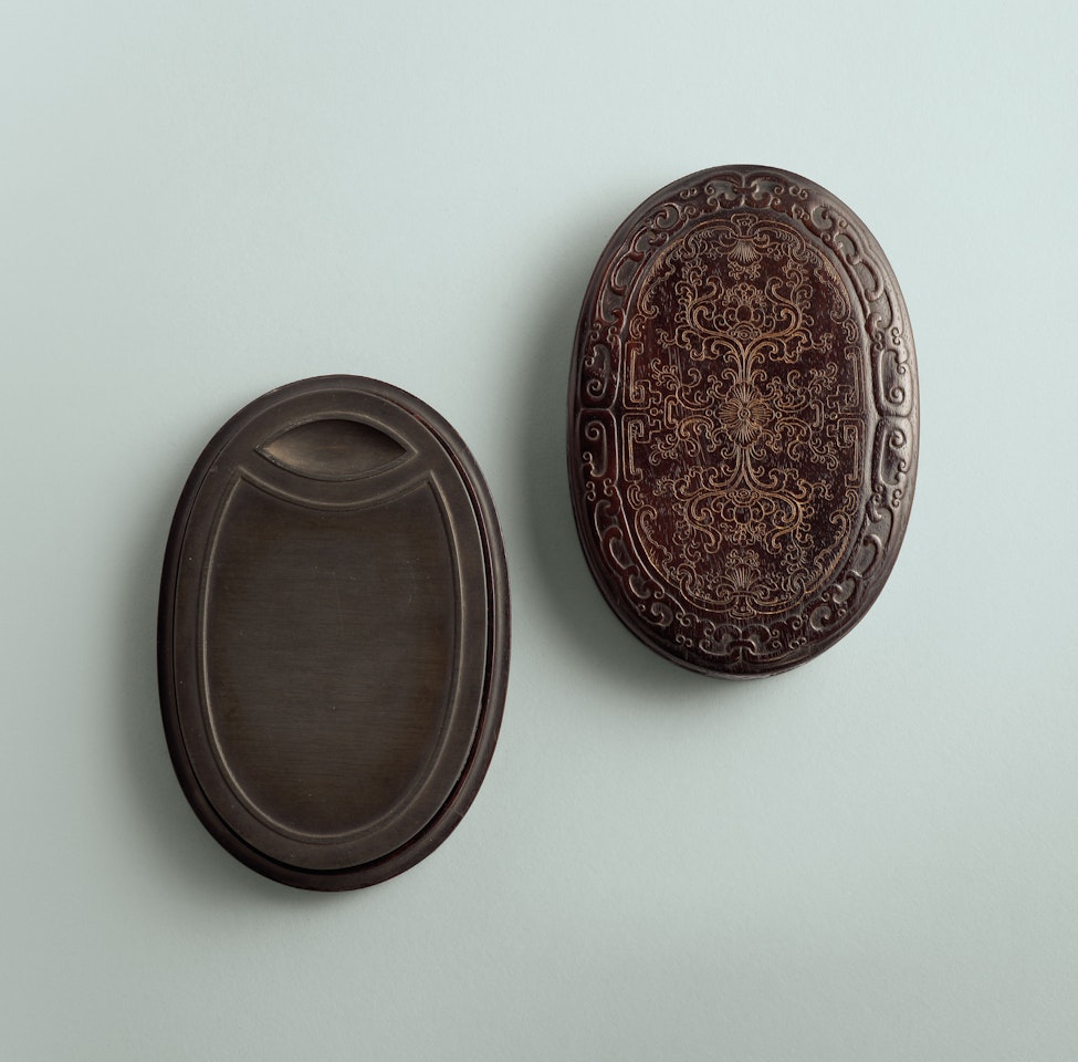 AN IMPERIAL INSCRIBED SHE OVAL INKSTONE by Anonymous