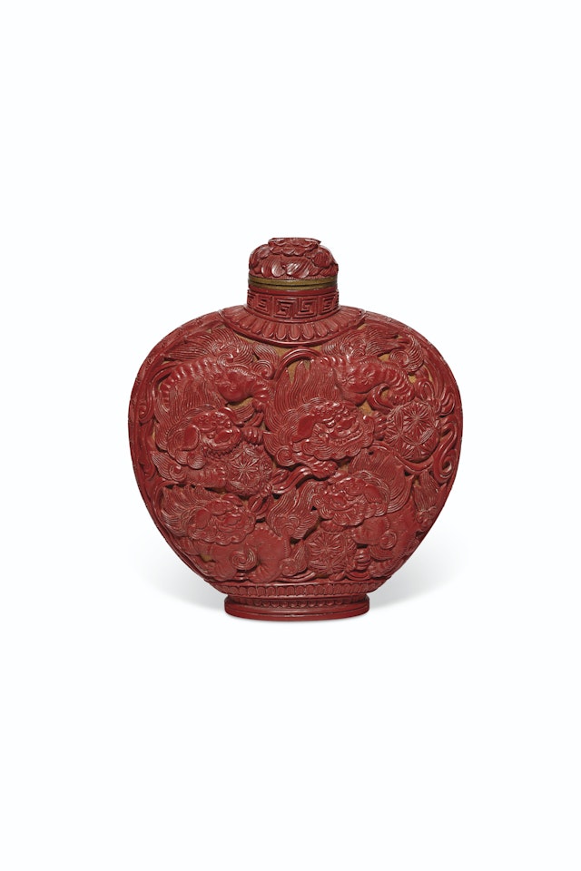 A FINELY CARVED RED LACQUER SNUFF BOTTLE by Anonymous