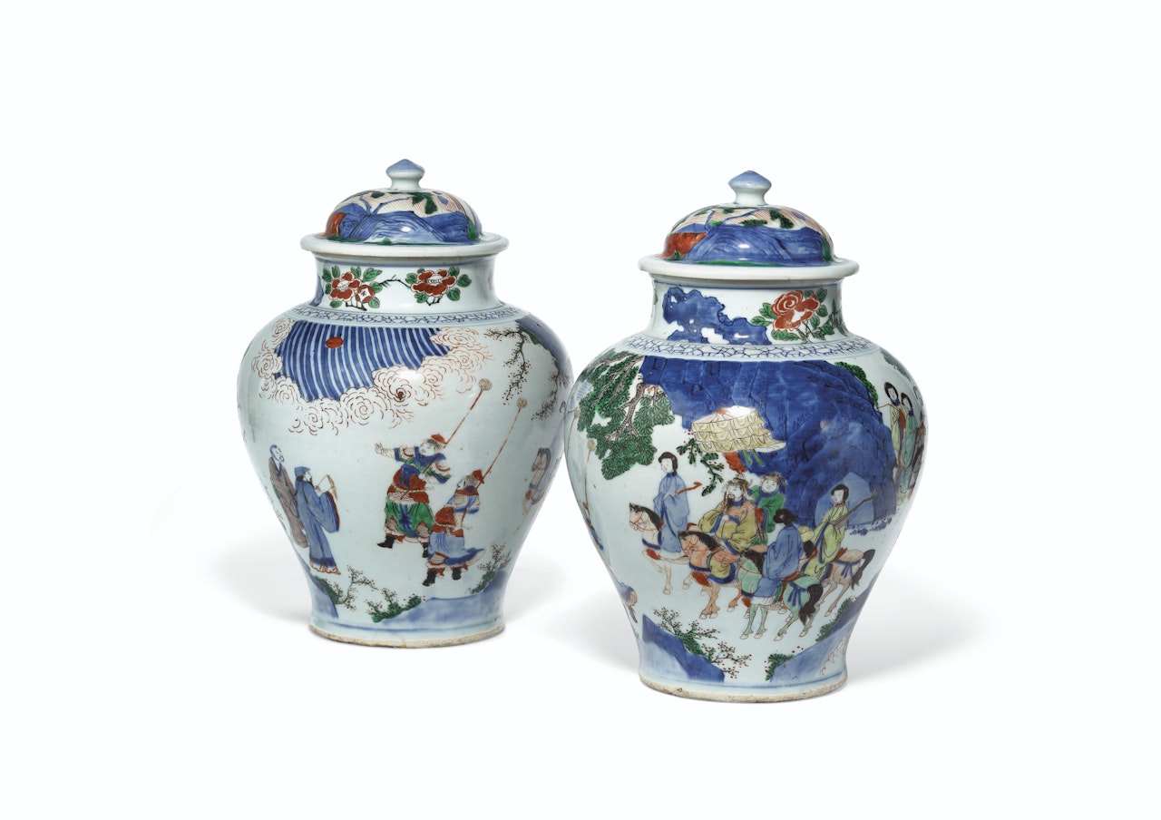 A PAIR OF WUCAI BALUSTER JARS AND COVERS by Anonymous