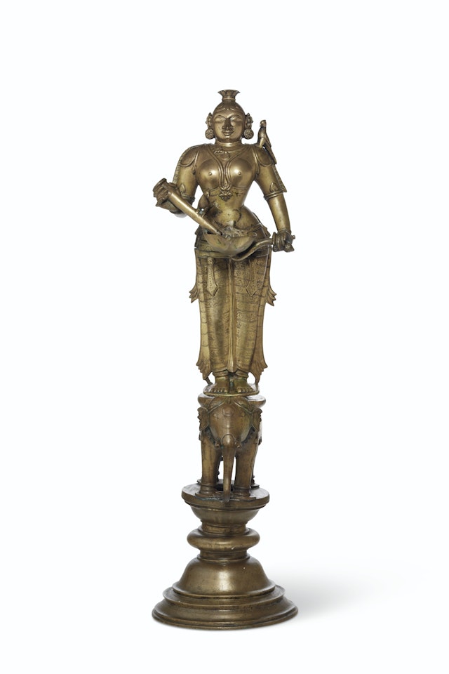 A LARGE BRASS FIGURE OF LAKSHMI by Anonymous