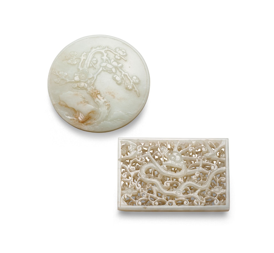 A RETICULATED WHITE JADE RECTANGULAR ‘DRAGON’ PLAQUE AND A CARVED WHITE JADE CIRCULAR ‘PRUNUS’ PLAQUE by Anonymous