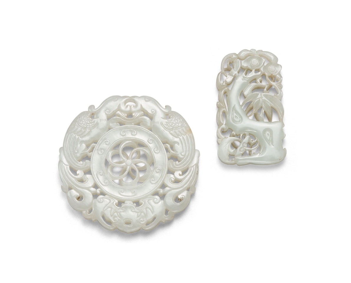 TWO WHITE JADE RETICULATED PLAQUES by Anonymous