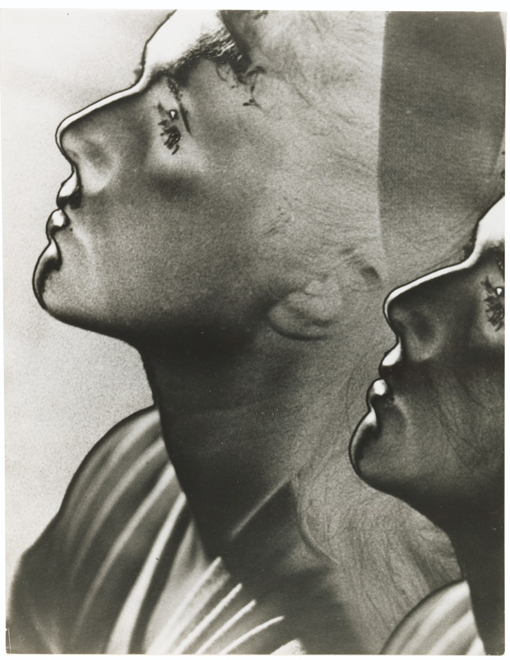 Double profile, solarized by Man Ray
