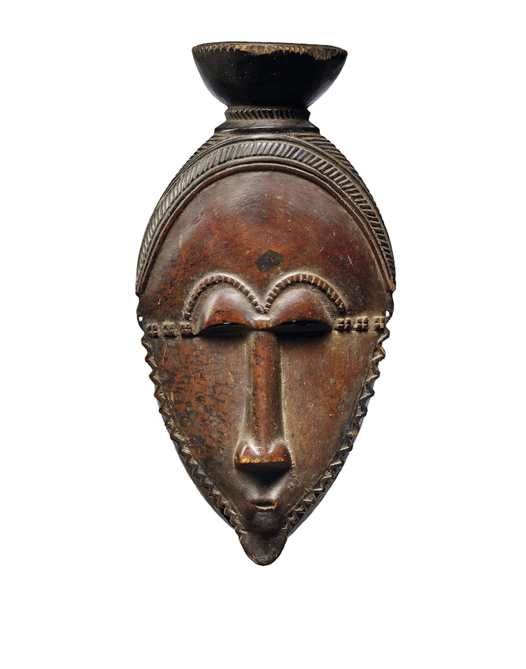 MASQUE-PORTRAIT BAOULÉ, NDOMA
A BAULE PORTRAIT MASK by Anonymous