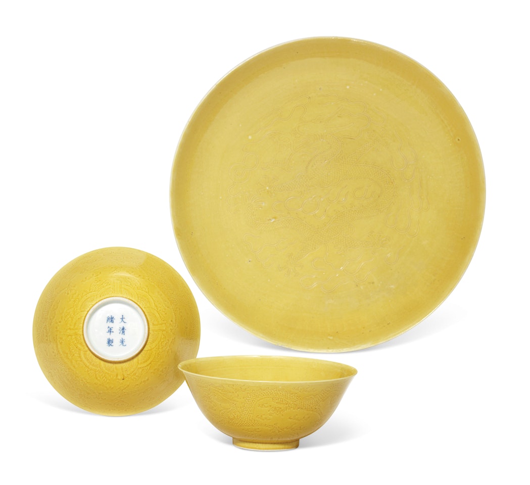 A PAIR OF YELLOW-GLAZED 'DRAGON' BOWLS AND A DISH by Anonymous