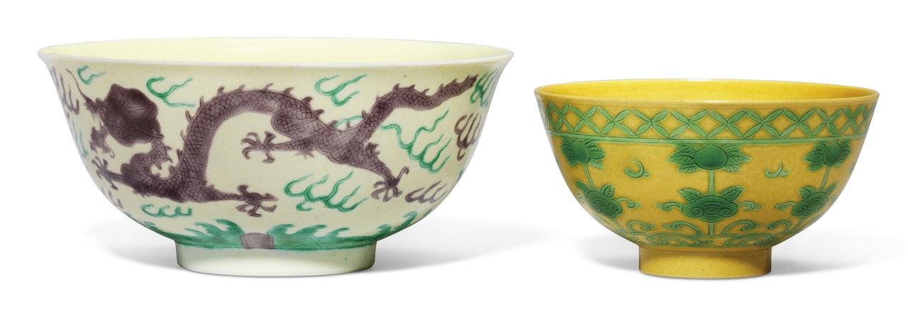 A GREEN AND AUBERGINE-ENAMELLED YELLOW-GROUND 'DRAGON' BOWL AND A GREEN-ENAMELLED YELLOW-GROUND 'PEACH' BOWL by Anonymous