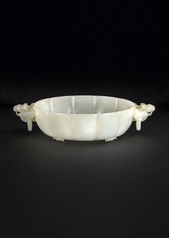 A FINELY CARVED WHITE JADE MARRIAGE BOWL by Anonymous
