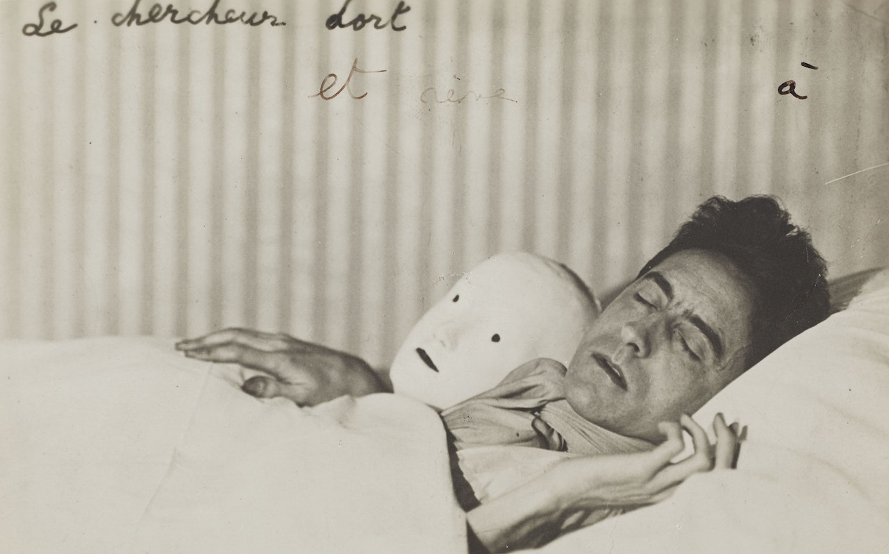 Jean Cocteau couché avec le masque d'Antigone by Berenice Abbott