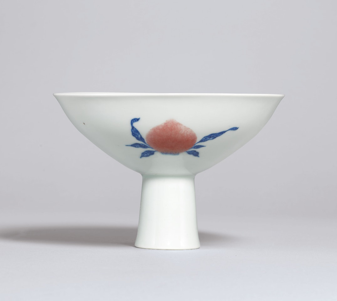 A FINE COPPER-RED AND UNDERGLAZE-BLUE DECORATED ‘SANDUO’ STEM BOWL by Anonymous