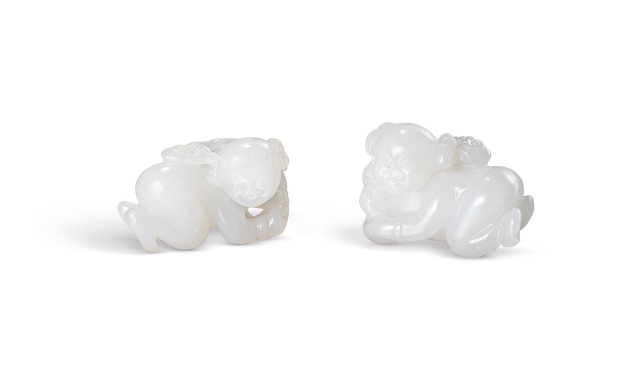 TWO WHITE JADE ‘BOY AND LINGZHI’ TOGGLES by Anonymous