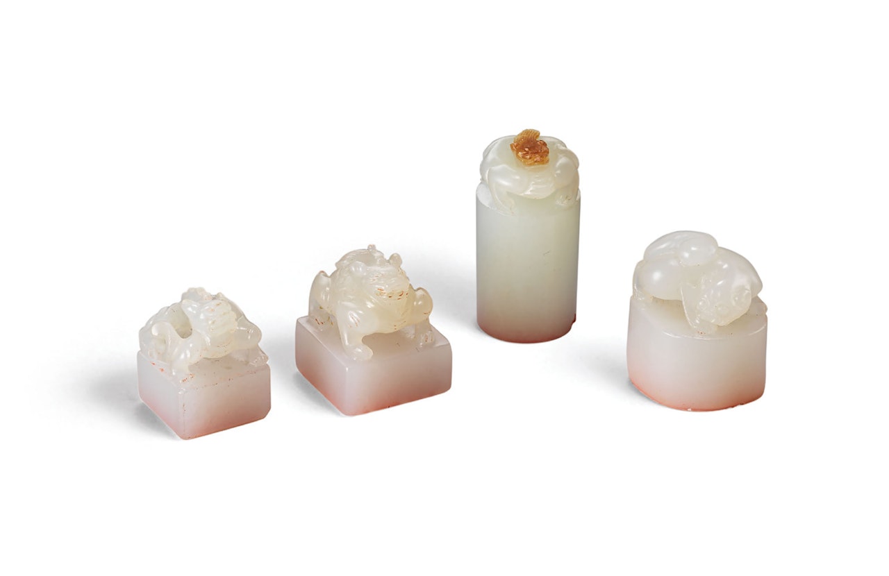 FOUR MINIATURE WHITE JADE SEALS by Anonymous