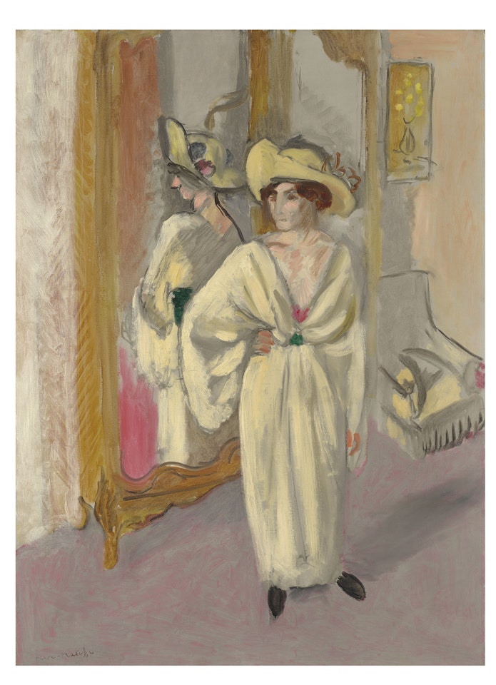 Femme en blanc debout devant une glace by Henri Matisse