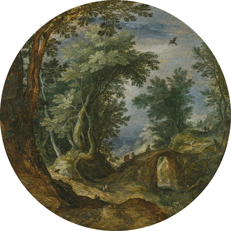 A WOODED LANDSCAPE WITH FIGURES CROSSING A BRIDGE by Jan Brueghel the Younger