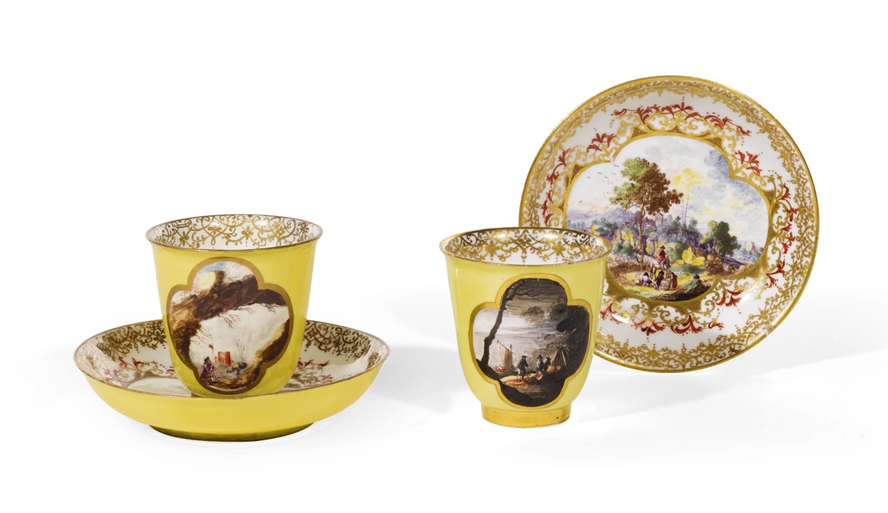 Two Meissen yellow ground beakers and saucers by Anonymous