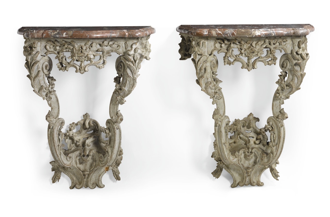 A pair of Louis XV green painted and carved wood console tables 
 by Anonymous