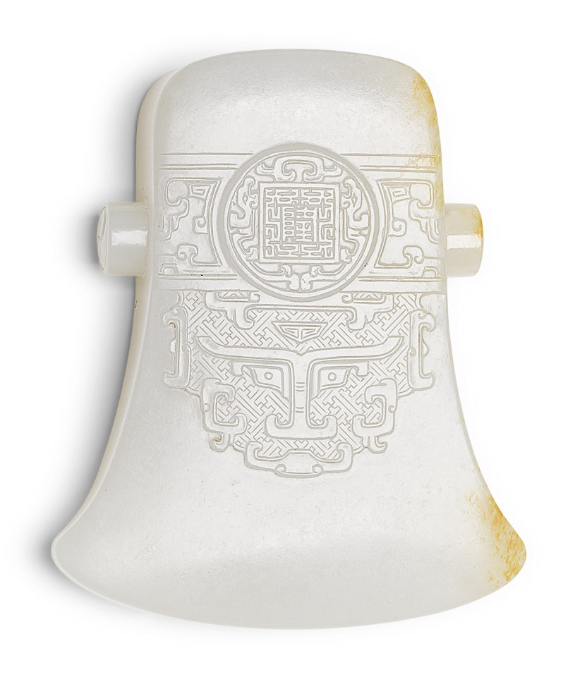 A WHITE JADE ARCHAISTIC BLADE by Anonymous